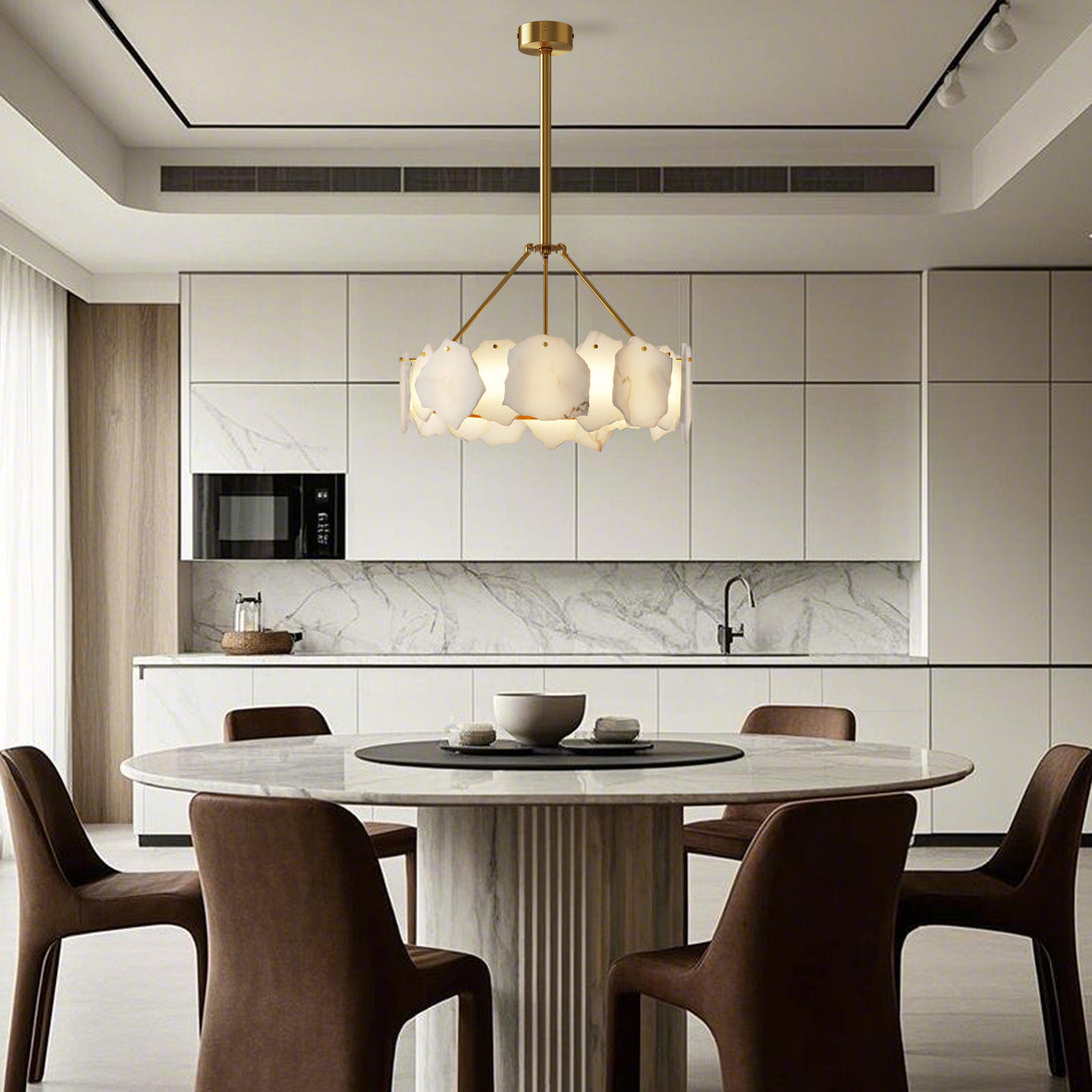 Compact round chandelier with irregular pale panels above a circular dining table in a bright kitchen